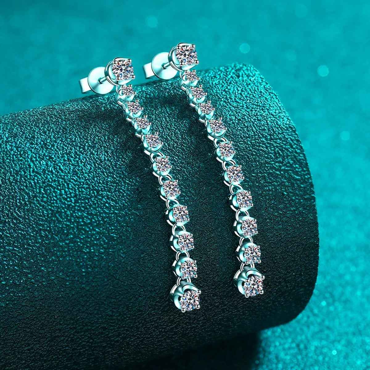 Round Moissanite Stud Dangle Earrings in Rhodium-Plated S925 sterling silver product scene view showing angled setting detail