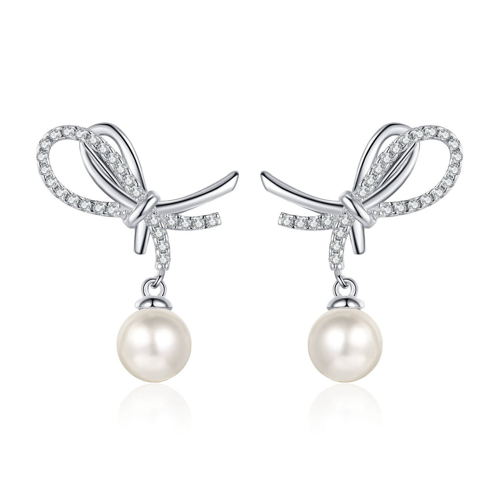Bow Pearl Moissanite Stud Dangle Earrings in Rhodium-Plated S925 sterling silver on white background showing the full pair, pearl and moissanite detail, and stud dangle earrings silhouette