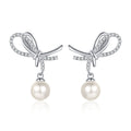 Bow Pearl Moissanite Stud Dangle Earrings in Rhodium-Plated S925 sterling silver on white background showing the full pair, pearl and moissanite detail, and stud dangle earrings silhouette