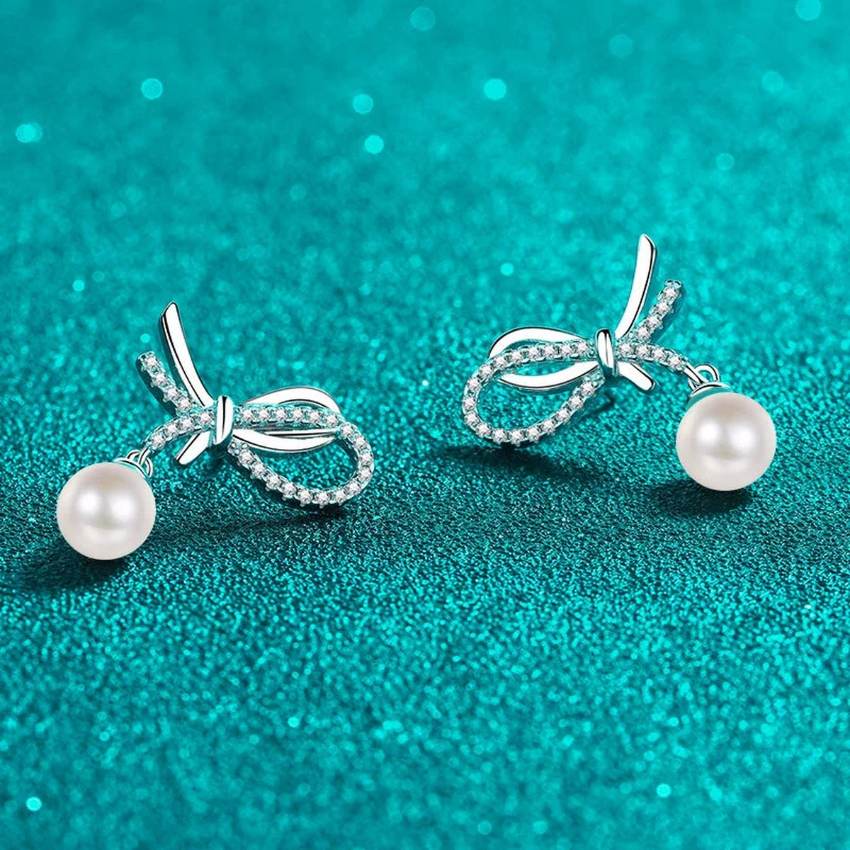 Bow Pearl Moissanite Stud Dangle Earrings in Rhodium-Plated S925 sterling silver product scene view showing angled setting detail