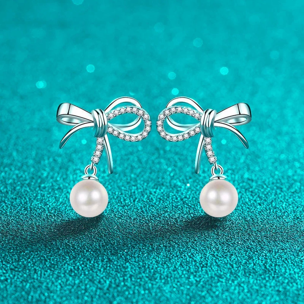 Bow Pearl and Moissanite Stud Dangle Earrings in Rhodium-Plated S925 sterling silver product scene view showing front sparkle