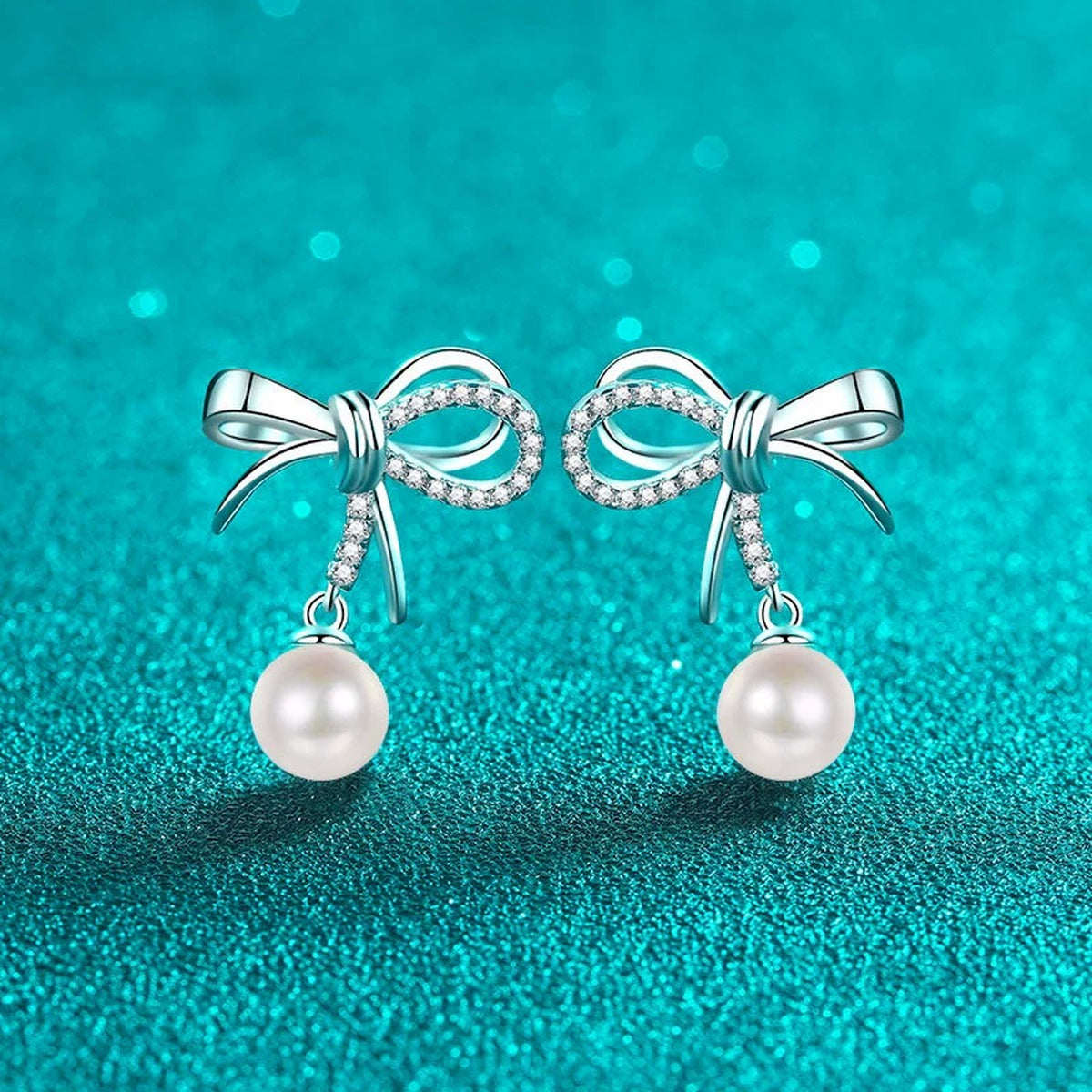 Bow Pearl and Moissanite Stud Dangle Earrings in Rhodium-Plated S925 sterling silver product scene view showing front sparkle