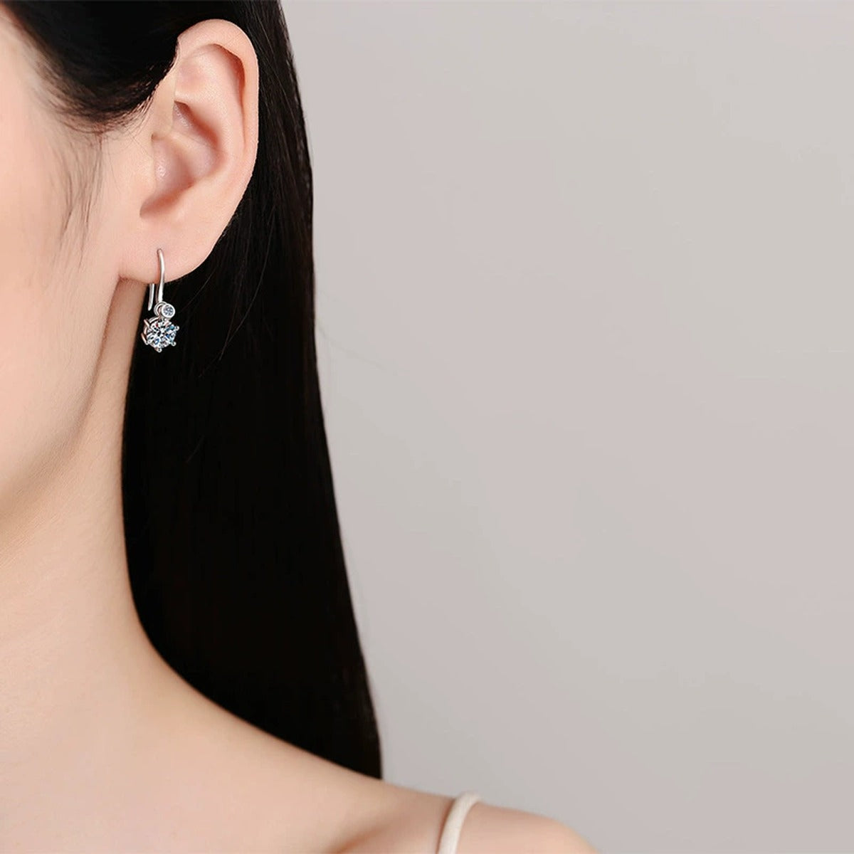 Round Moissanite Hook Drop Earrings in Rhodium-Plated S925 sterling silver worn on ear by model showing scale, placement, and hook drop earrings styling
