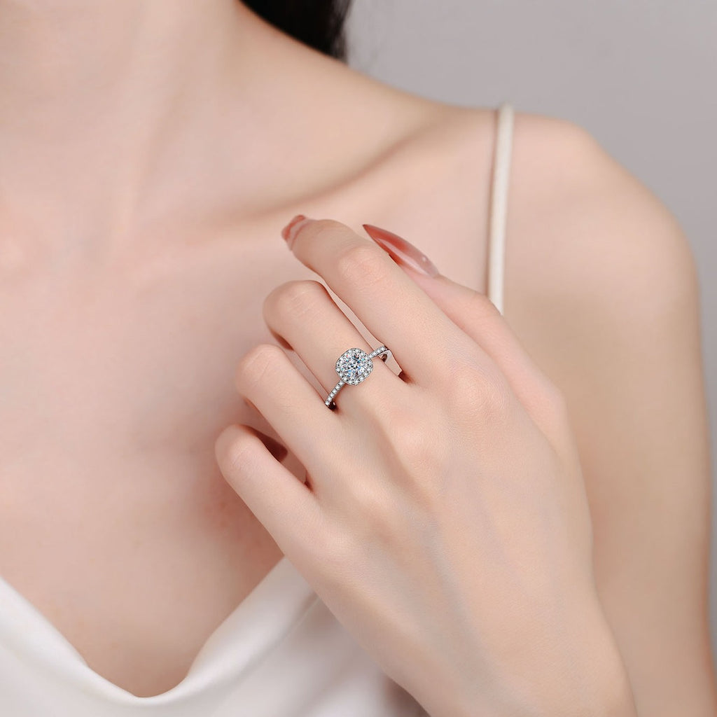 Cushion Cut Moissanite Halo Engagement Ring with CZ in Rhodium-Plated S925 Sterling Silver worn on hand, showing scale, finger coverage, and rhodium-plated finish