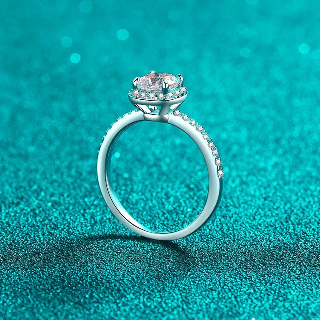 Cushion Cut Moissanite Halo Engagement Ring with CZ in Rhodium-Plated S925 Sterling Silver blue display product photo showing the moissanite setting, stone cut, and band profile