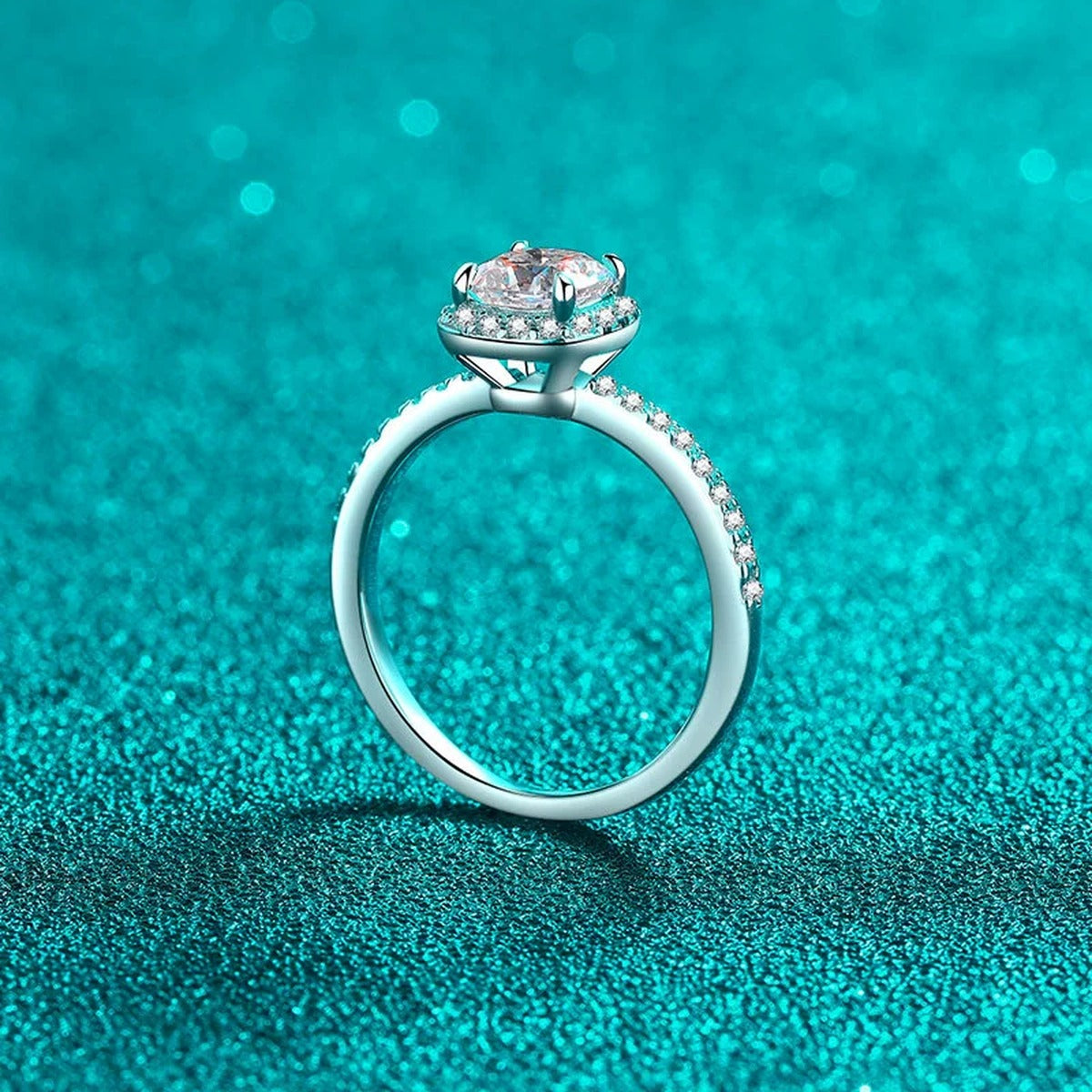 Cushion Cut Moissanite Halo Engagement Ring with CZ in Rhodium-Plated S925 Sterling Silver blue display product photo showing the moissanite setting, stone cut, and band profile