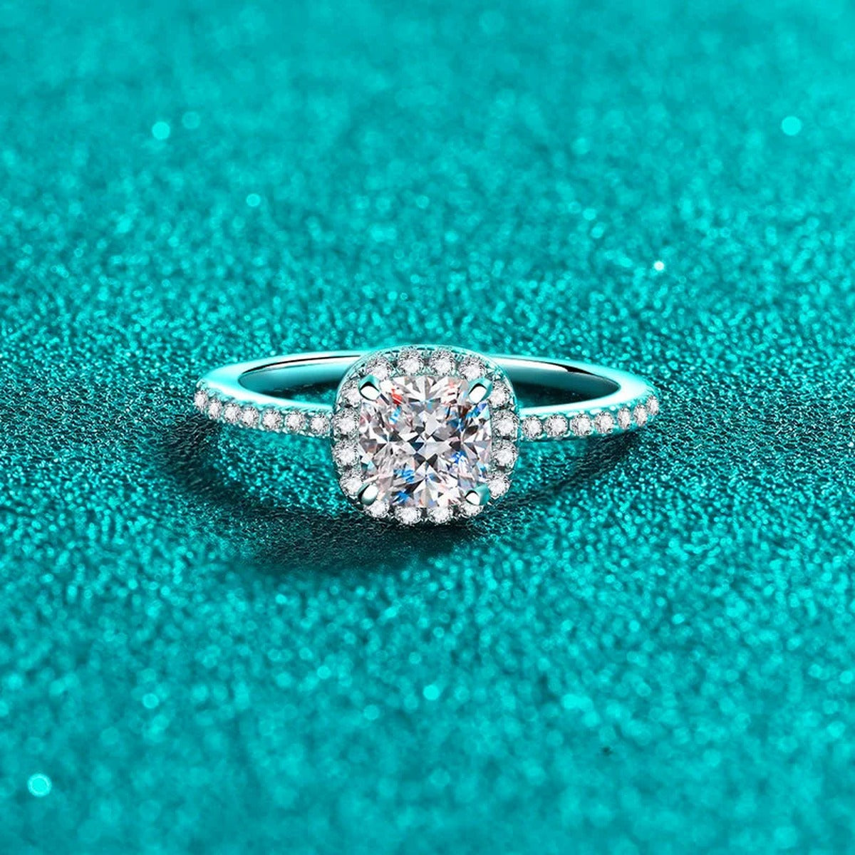 Cushion Cut Moissanite Halo Engagement Ring with CZ in Rhodium-Plated S925 Sterling Silver blue display product photo showing the moissanite setting, stone cut, and band profile