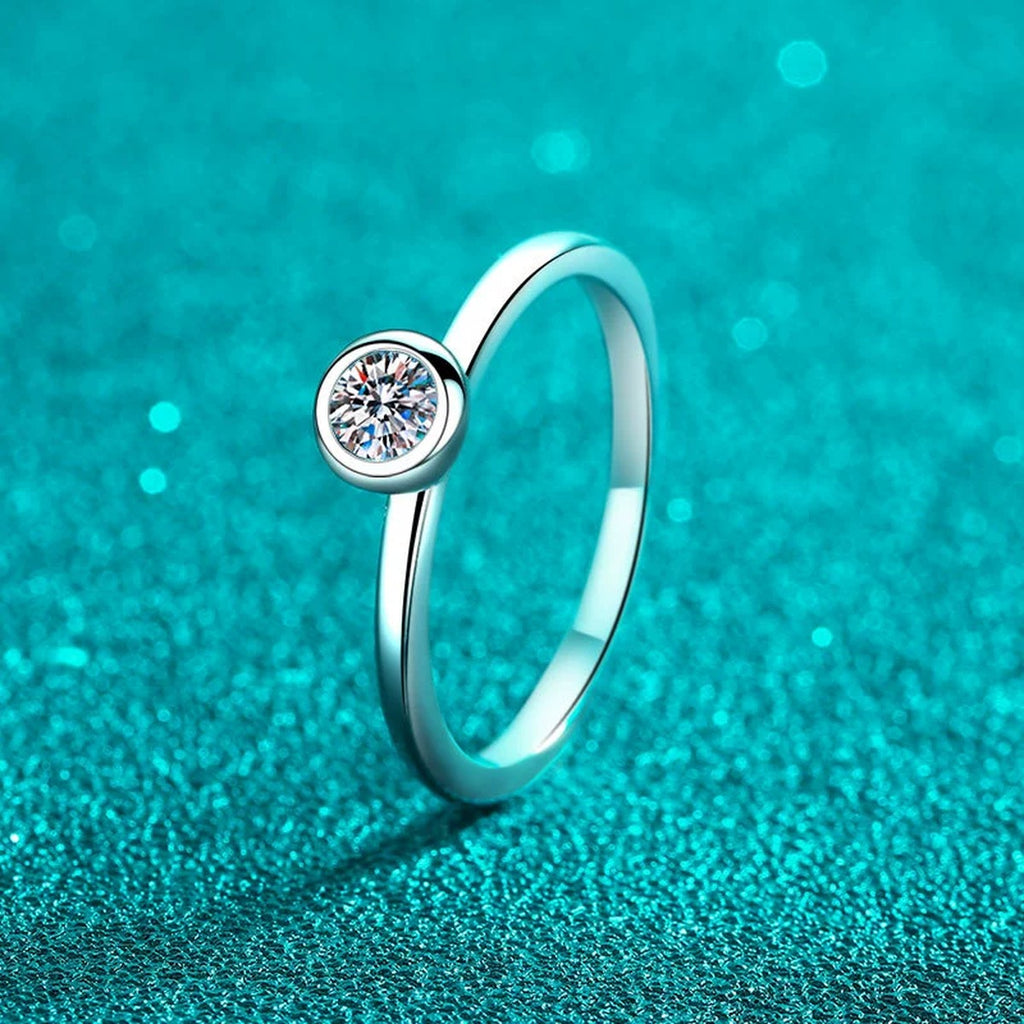 Round Moissanite Solitaire Ring product view showing moissanite setting and metal finish