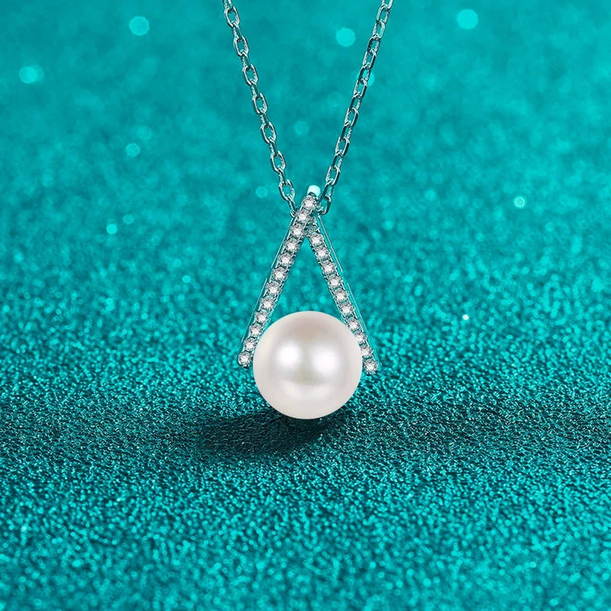 Teardrop Moissanite Pearl Pendant Necklace in Rhodium-Plated S925 sterling silver blue display scene showing chain and stone layout