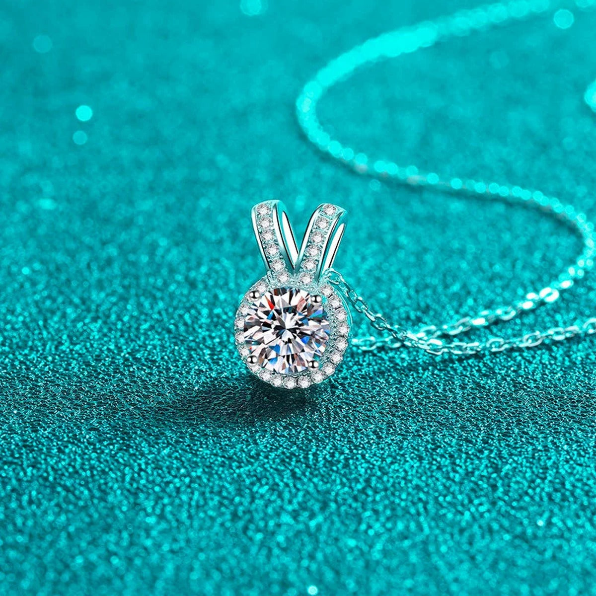 V Halo Moissanite Pendant Necklace with CZ in Rhodium-Plated S925 sterling silver blue display scene showing chain and stone layout