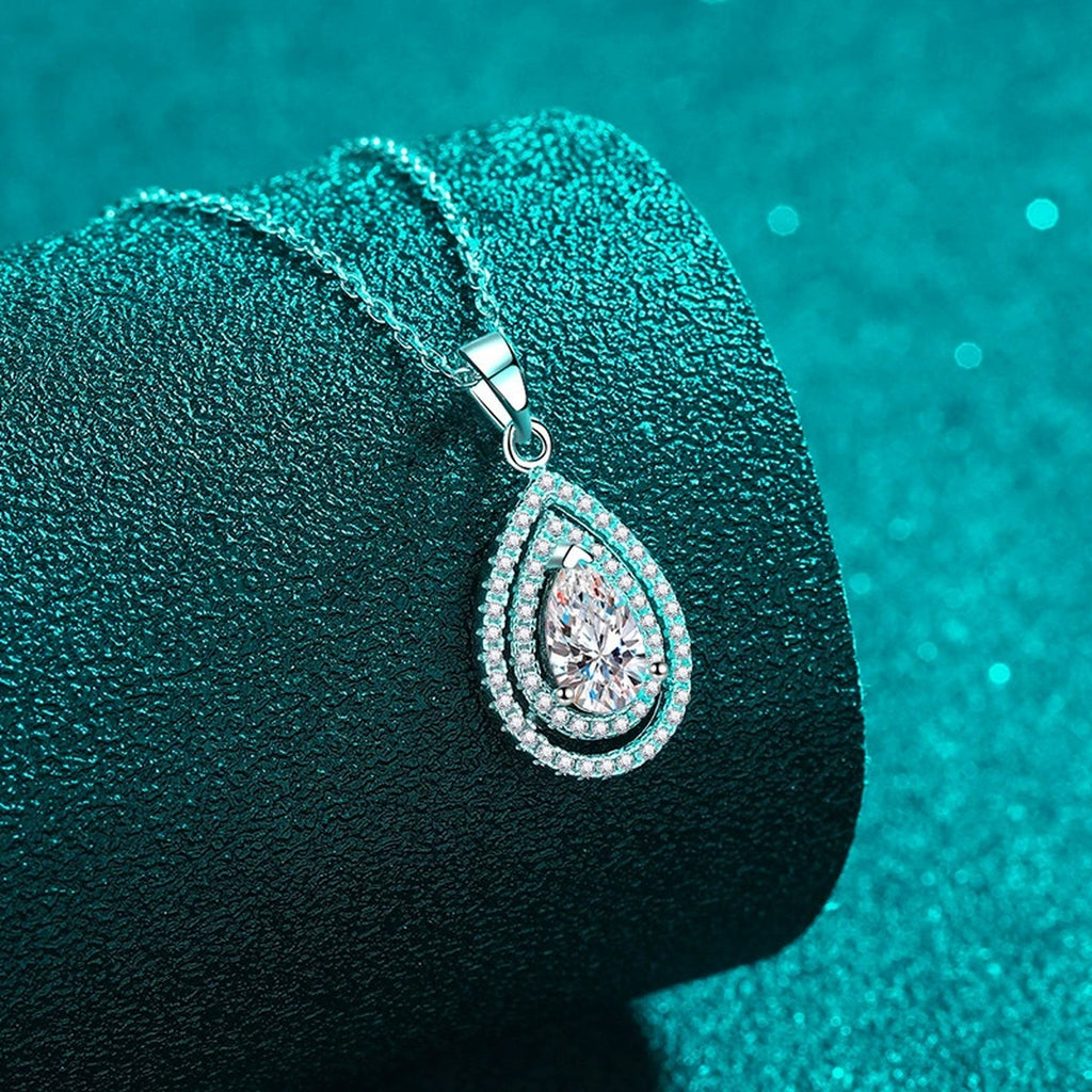 Pear Cut Halo Moissanite Pendant Necklace with CZ in Rhodium-Plated S925 sterling silver close-up product scene showing pendant setting