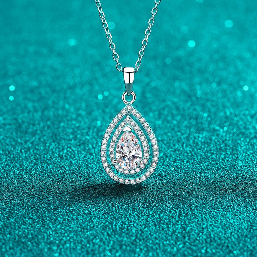 Pear Cut Halo Moissanite Pendant Necklace with CZ in Rhodium-Plated S925 sterling silver display scene showing chain and stone layout