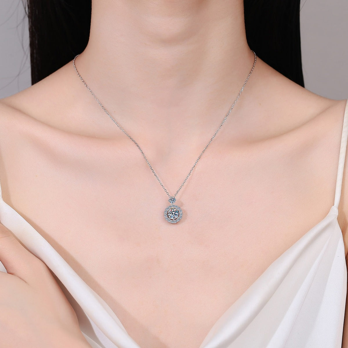 Round Halo Moissanite Pendant Necklace with CZ in Rhodium-Plated S925 sterling silver neckline model view showing pendant scale and chain length