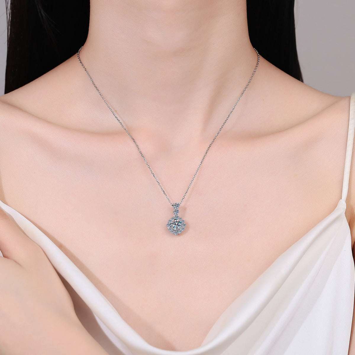 Round Halo Moissanite Pendant Necklace with CZ in Rhodium-Plated S925 sterling silver neckline model view showing pendant scale and adjustable chain