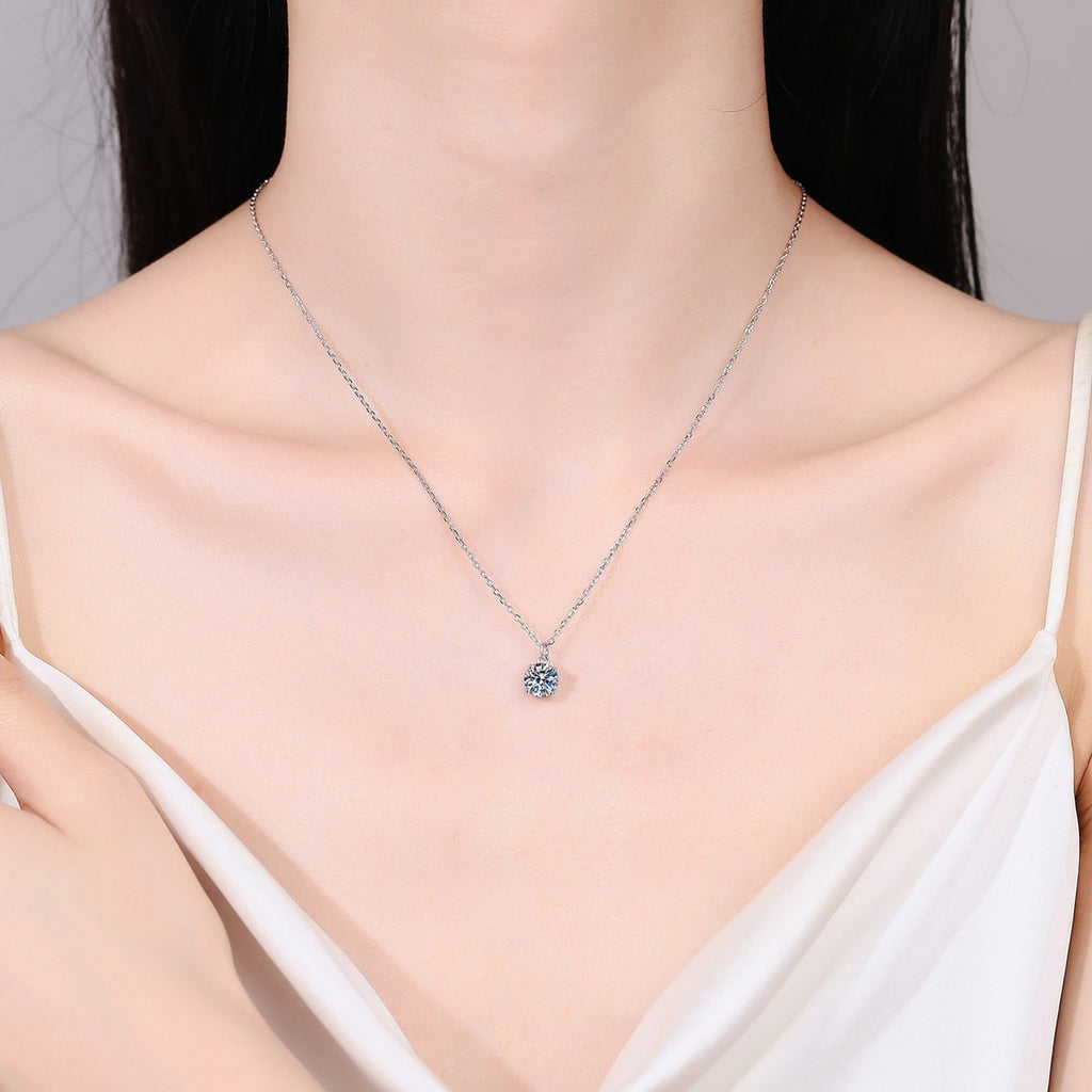 Round Solitaire Moissanite Pendant Necklace in Rhodium-Plated S925 sterling silver neckline model view showing pendant scale and adjustable chain