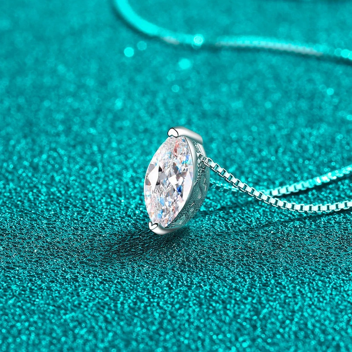Marquise Solitaire Moissanite Pendant Necklace in Rhodium-Plated S925 sterling silver blue display scene showing chain and stone layout