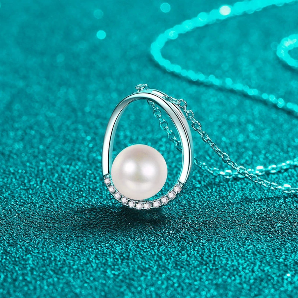Open Teardrop Moissanite Pearl Necklace in Rhodium-Plated S925 sterling silver blue display scene showing chain and stone layout