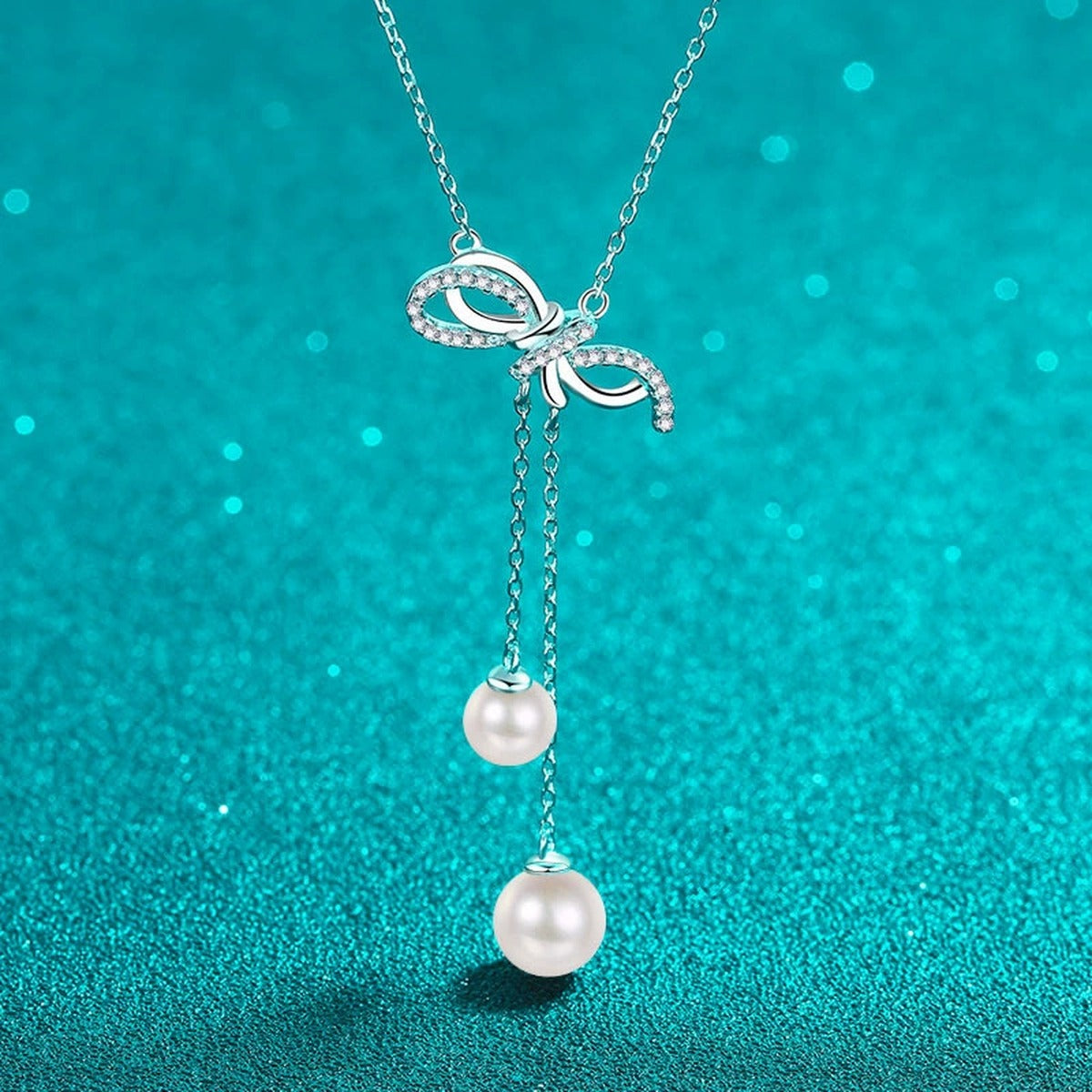 Bow Lariat Moissanite Pearl Necklace in Rhodium-Plated S925 sterling silver close-up product scene showing pendant setting