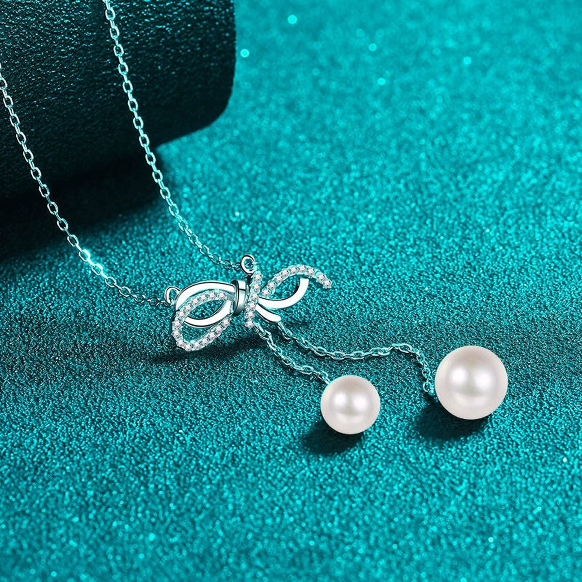 Bow Lariat Moissanite Pearl Necklace in Rhodium-Plated S925 sterling silver angled product detail view