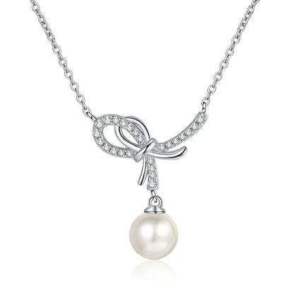 Bow Moissanite Pearl Pendant Necklace in Rhodium-Plated S925 sterling silver white background product photo showing open bow pearl pendant with small round moissanite accents