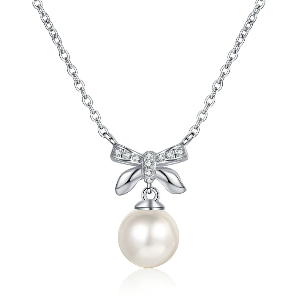 Bow Moissanite Pearl Pendant Necklace in Rhodium-Plated S925 sterling silver white background product photo showing petite bow pearl pendant with small round moissanite accents