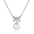 Bow Moissanite Pearl Pendant Necklace in Rhodium-Plated S925 sterling silver white background product photo showing petite bow pearl pendant with small round moissanite accents