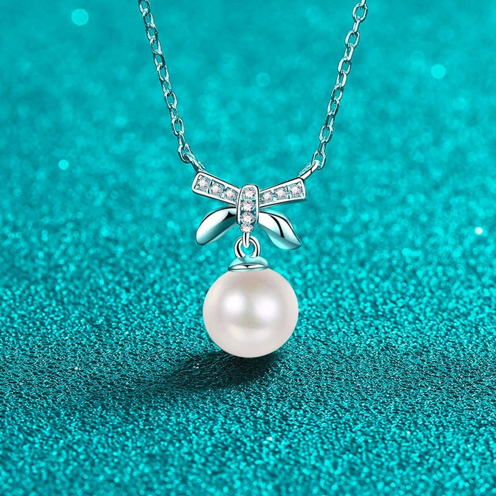 Bow Moissanite Pearl Pendant Necklace in Rhodium-Plated S925 sterling silver close-up product scene showing pendant setting