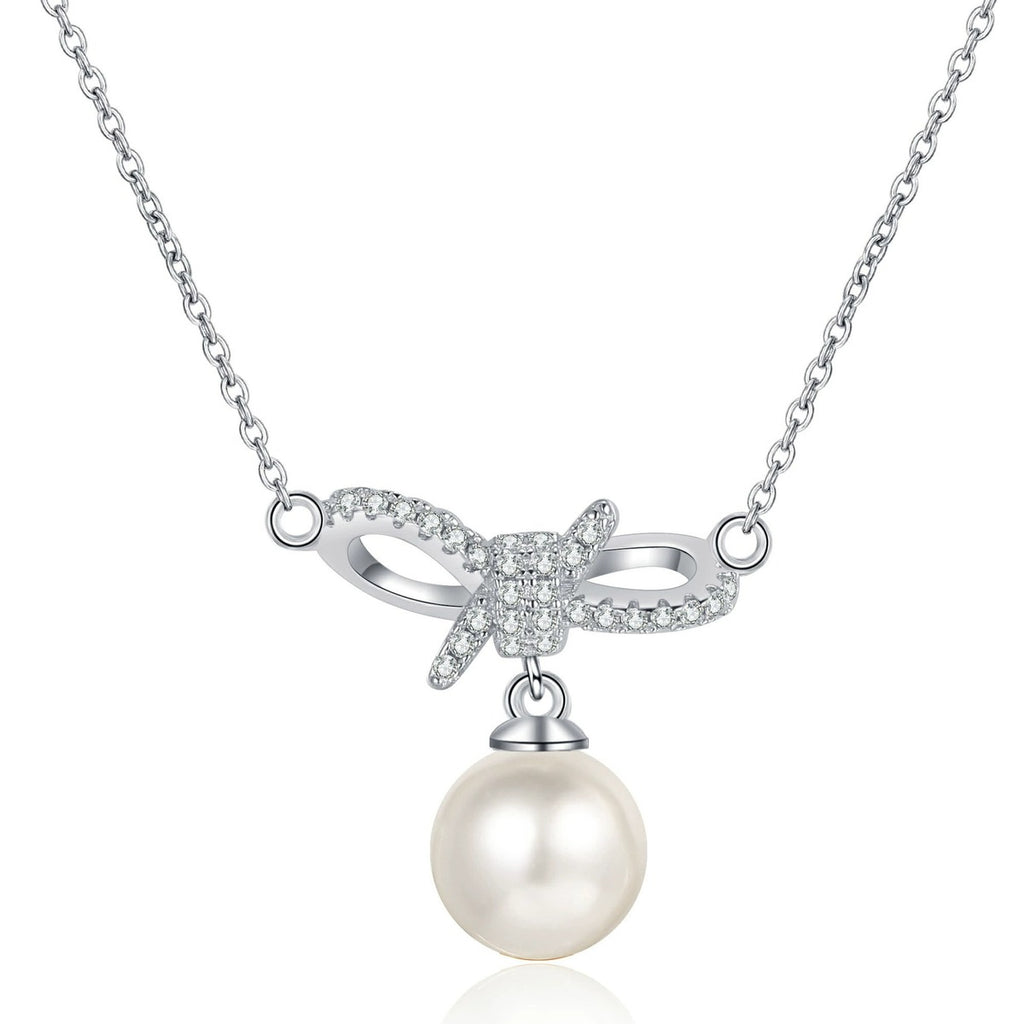 Ribbon Bow Moissanite Pearl Necklace in Rhodium-Plated S925 sterling silver white background product photo showing ribbon bow pearl pendant with round moissanite accents