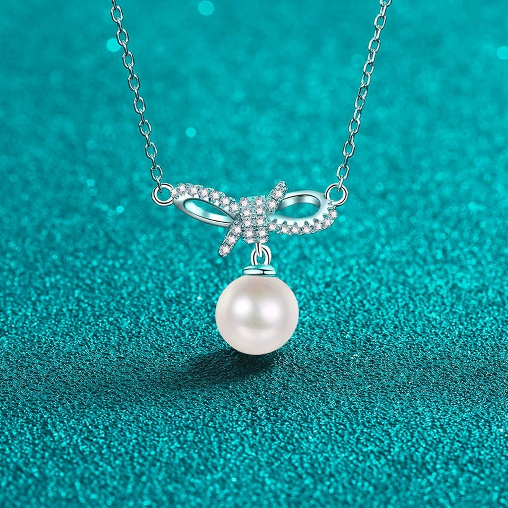 Ribbon Bow Moissanite Pearl Necklace in Rhodium-Plated S925 sterling silver close-up product scene showing pendant setting
