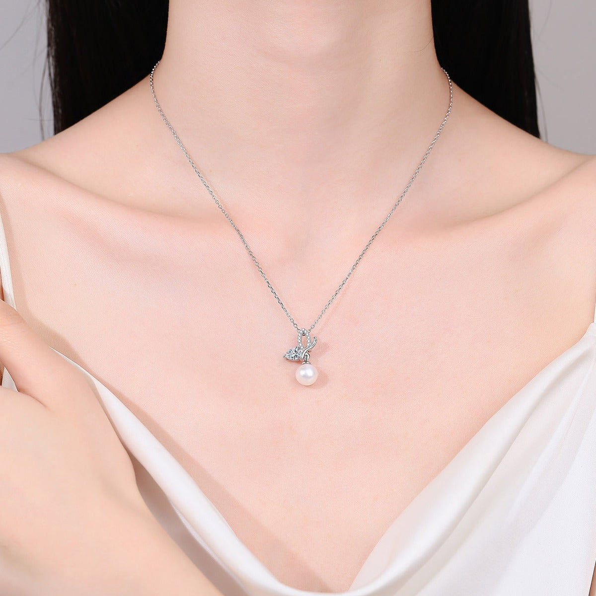 Butterfly Moissanite Pearl Necklace in Rhodium-Plated S925 sterling silver neckline model view showing pendant scale and adjustable chain