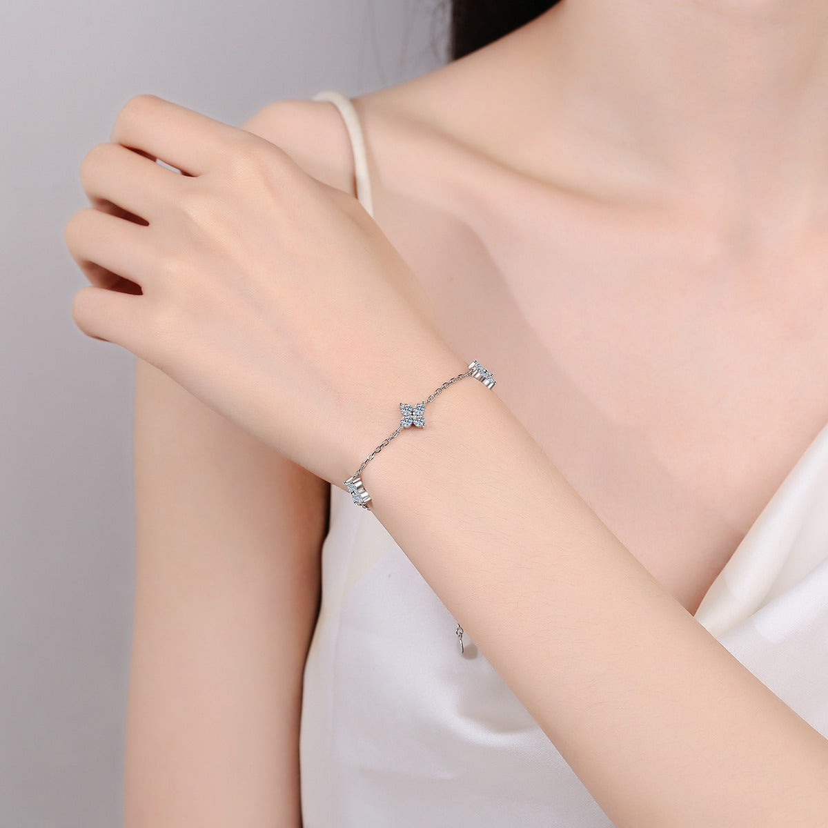 Clover Moissanite Adjustable Bracelet in Rhodium-Plated S925 sterling silver worn on wrist model view showing scale and adjustable fit