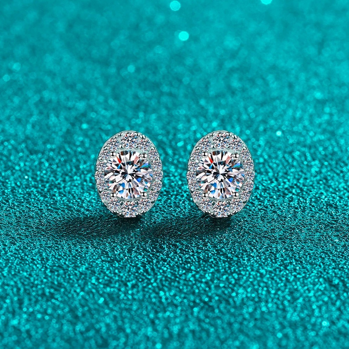 Oval Halo Round Moissanite Stud Earrings with CZ in Rhodium-Plated S925 sterling silver product scene view showing angled setting detail