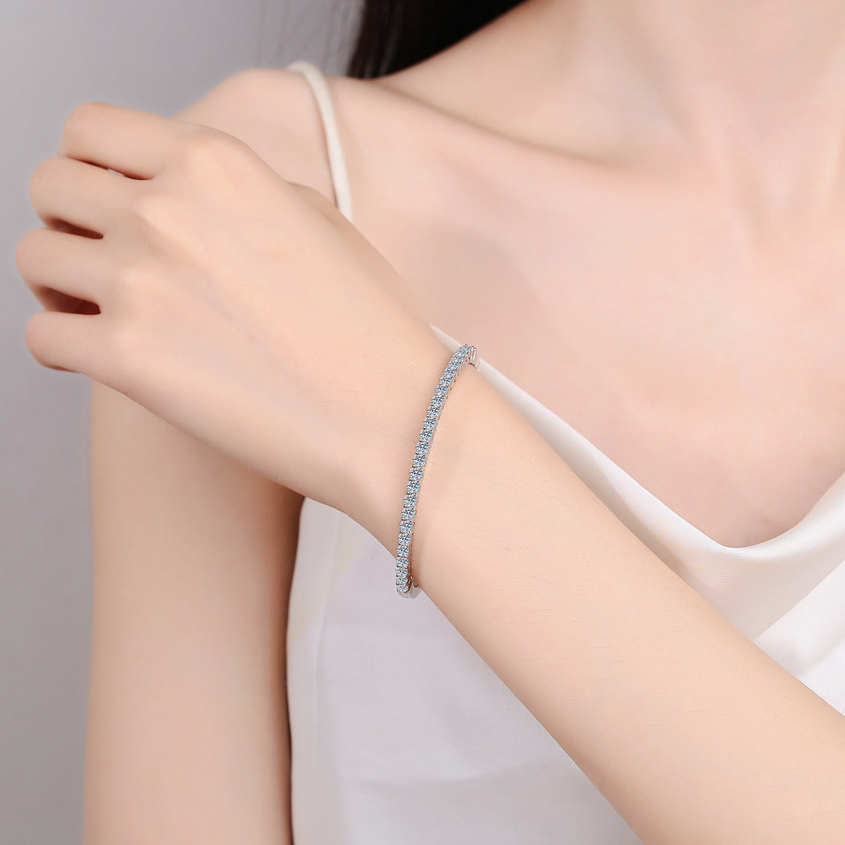 Round Moissanite Pave Bangle in Rhodium-Plated S925 sterling silver worn on wrist model view showing bangle scale and fit