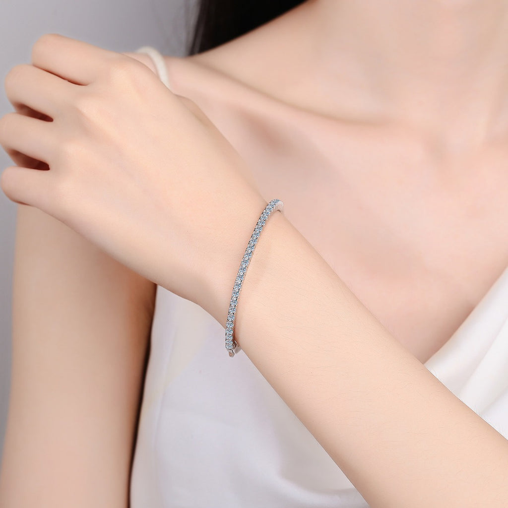 Slim Round Moissanite Bangle in Rhodium-Plated S925 sterling silver worn on wrist model view showing bangle scale and fit