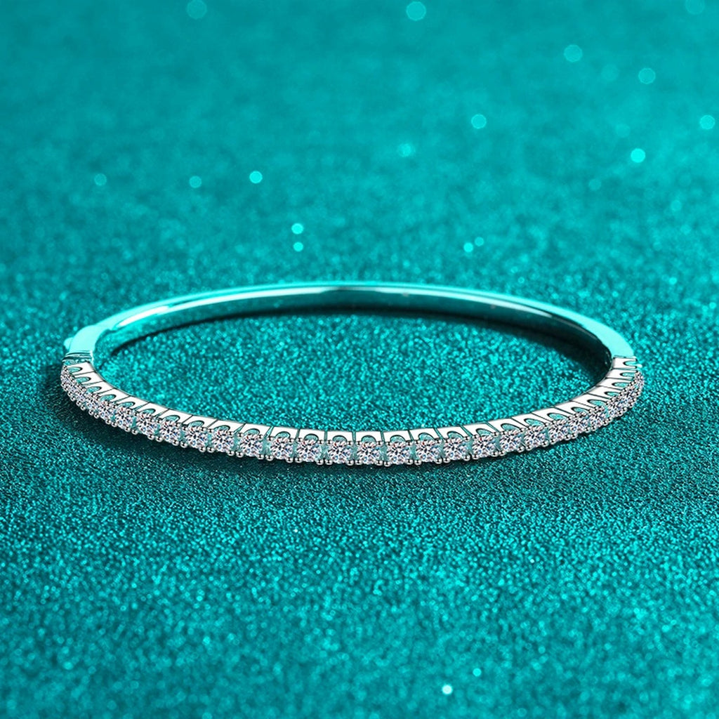 Slim Round Moissanite Bangle in Rhodium-Plated S925 sterling silver angled product display showing bangle silhouette
