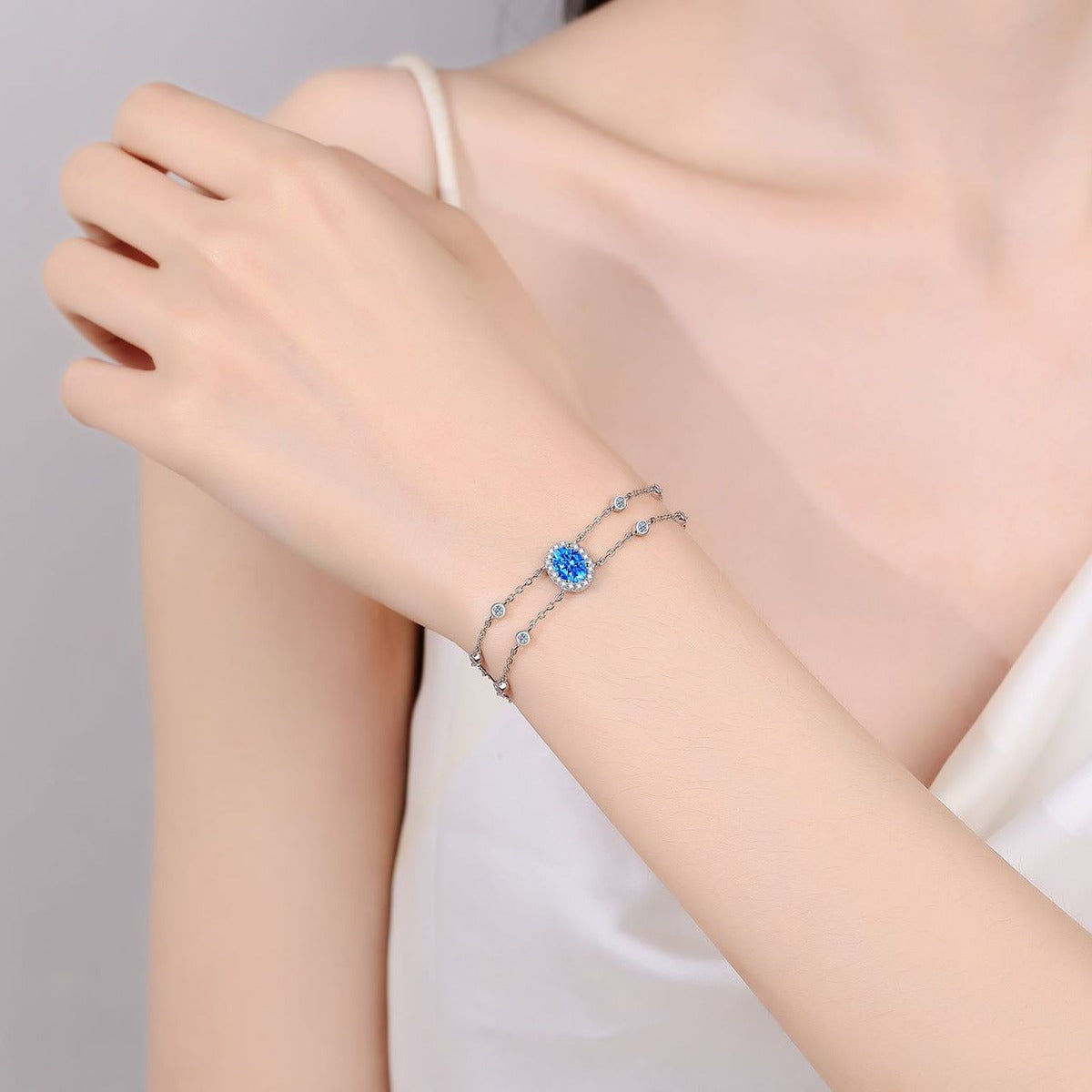 Oval Moissanite Adjustable Bracelet with CZ in Rhodium-Plated S925 sterling silver worn on wrist model view showing scale and adjustable fit