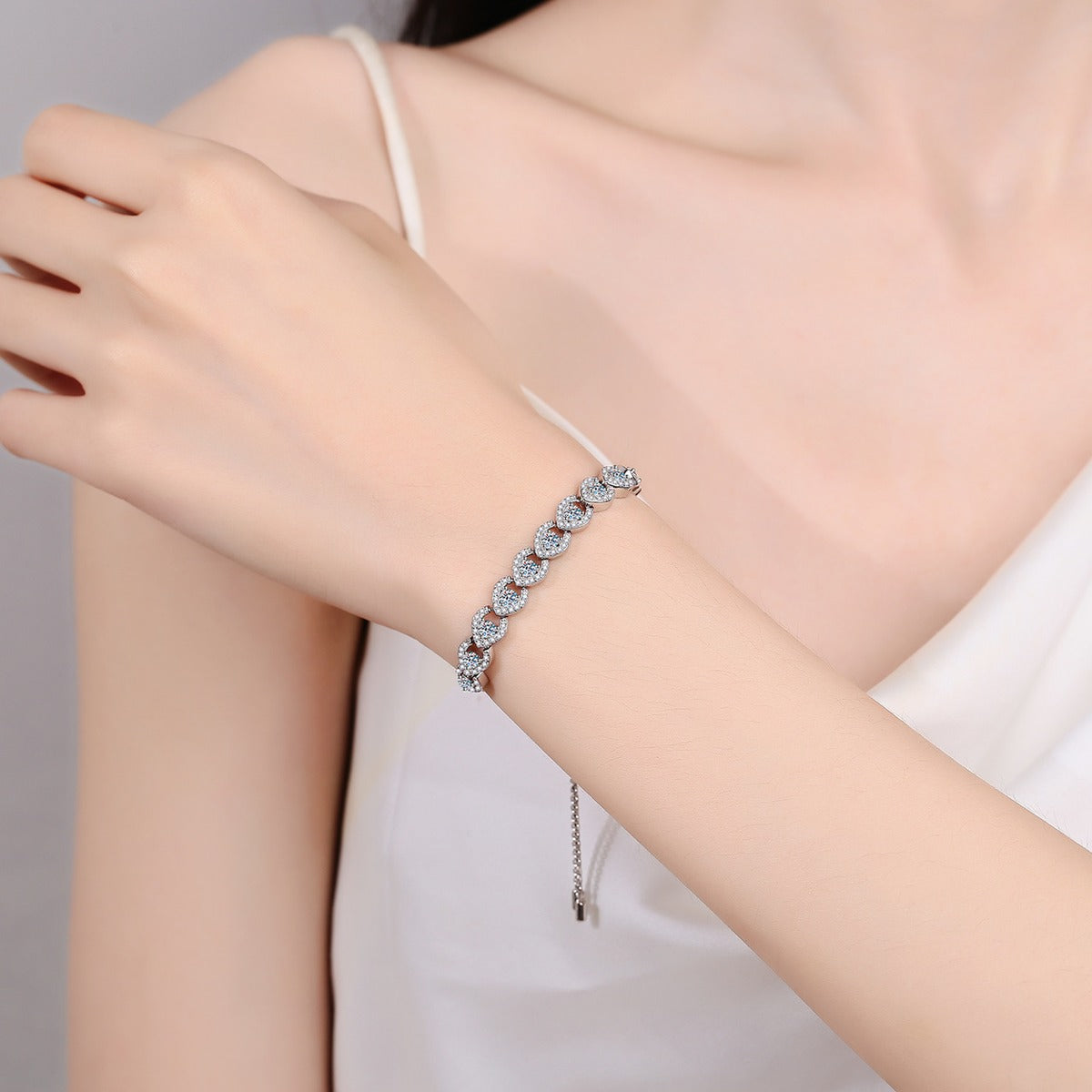 Round Moissanite Adjustable Tennis Bracelet with CZ in Rhodium-Plated S925 sterling silver worn on wrist model view showing scale and adjustable fit