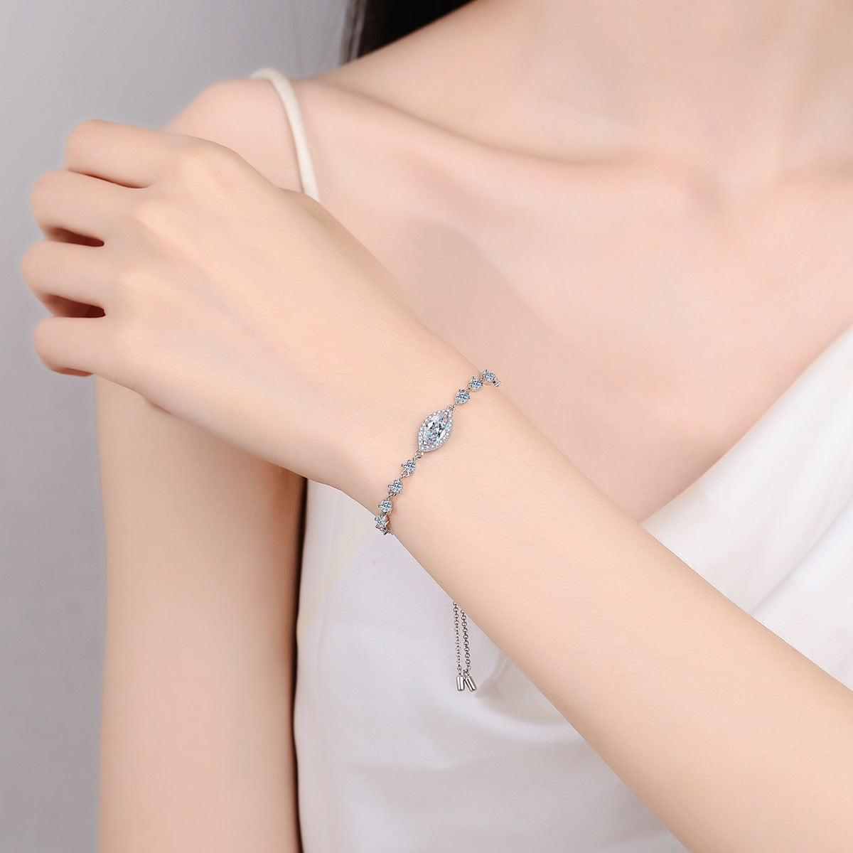 Marquise Moissanite Adjustable Tennis Bracelet with CZ in Rhodium-Plated S925 sterling silver worn on wrist model view showing scale and adjustable fit