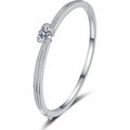 Round Moissanite Solitaire Bangle in Rhodium-Plated S925 sterling silver white background product photo showing bangle shape and moissanite setting