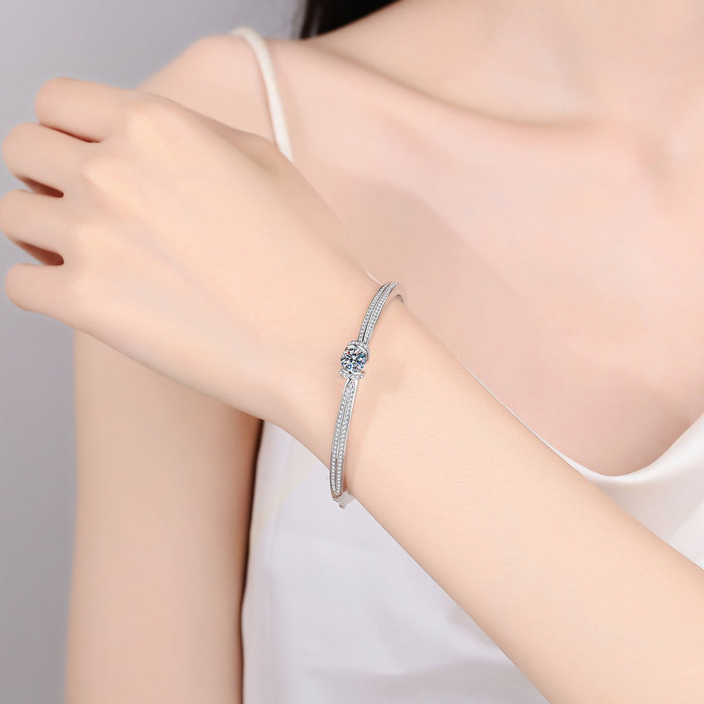 Round Moissanite Solitaire Bangle in Rhodium-Plated S925 sterling silver worn on wrist model view showing bangle scale and fit