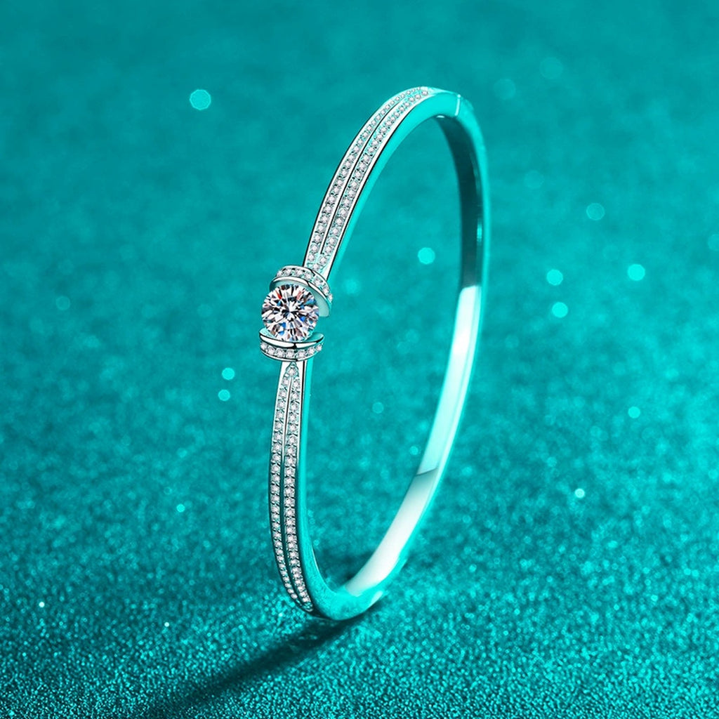 Round Moissanite Solitaire Bangle in Rhodium-Plated S925 sterling silver styled product scene showing moissanite sparkle and bangle detail