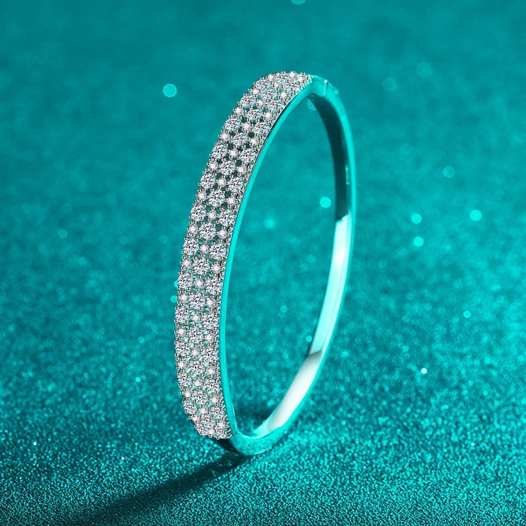 Wide Round Moissanite Pave Bangle in Rhodium-Plated S925 sterling silver styled product scene showing moissanite sparkle and bangle detail
