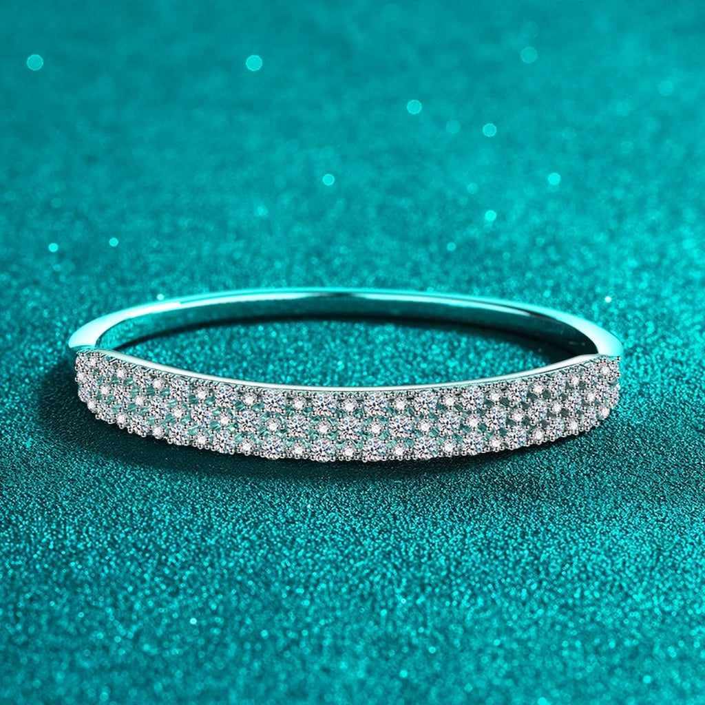 Wide Round Moissanite Pave Bangle in Rhodium-Plated S925 sterling silver angled product display showing bangle silhouette