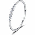 Beaded Round Moissanite Bangle in Rhodium-Plated S925 sterling silver white background product photo showing bangle shape and moissanite setting