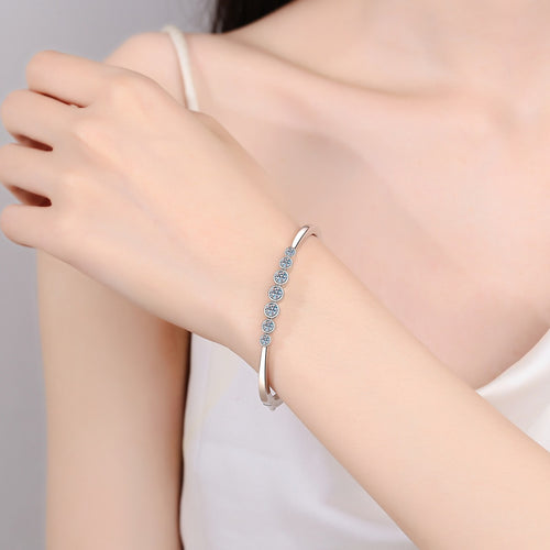 Beaded Round Moissanite Bangle in Rhodium-Plated S925 sterling silver worn on wrist model view showing bangle scale and fit