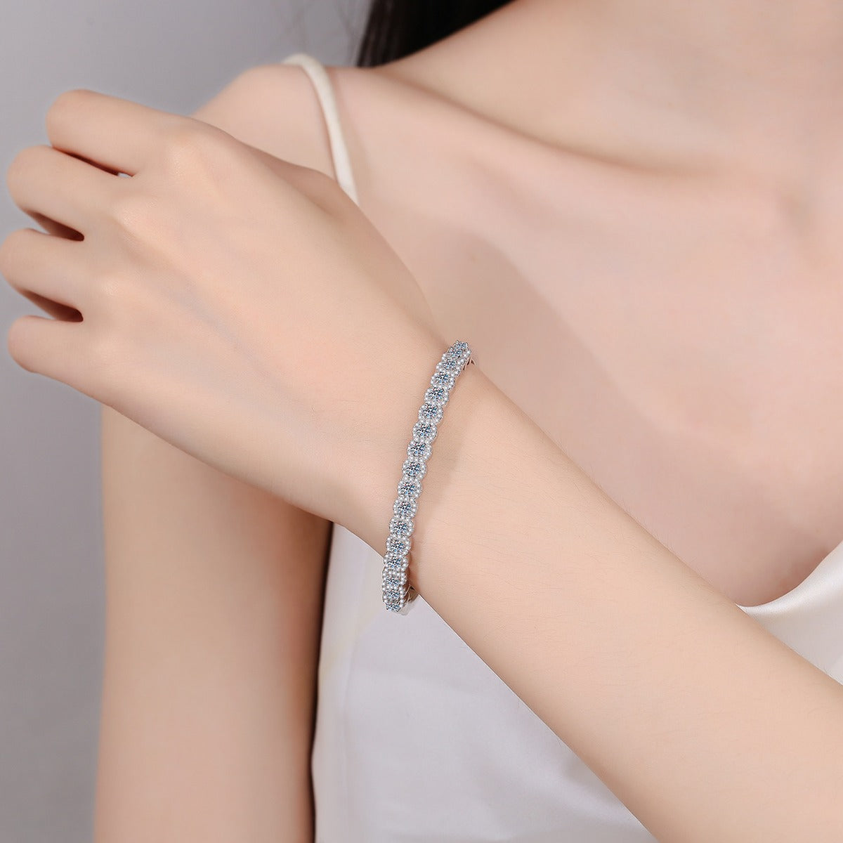 Double-Row Round Moissanite Bangle in Rhodium-Plated S925 sterling silver worn on wrist model view showing bangle scale and fit