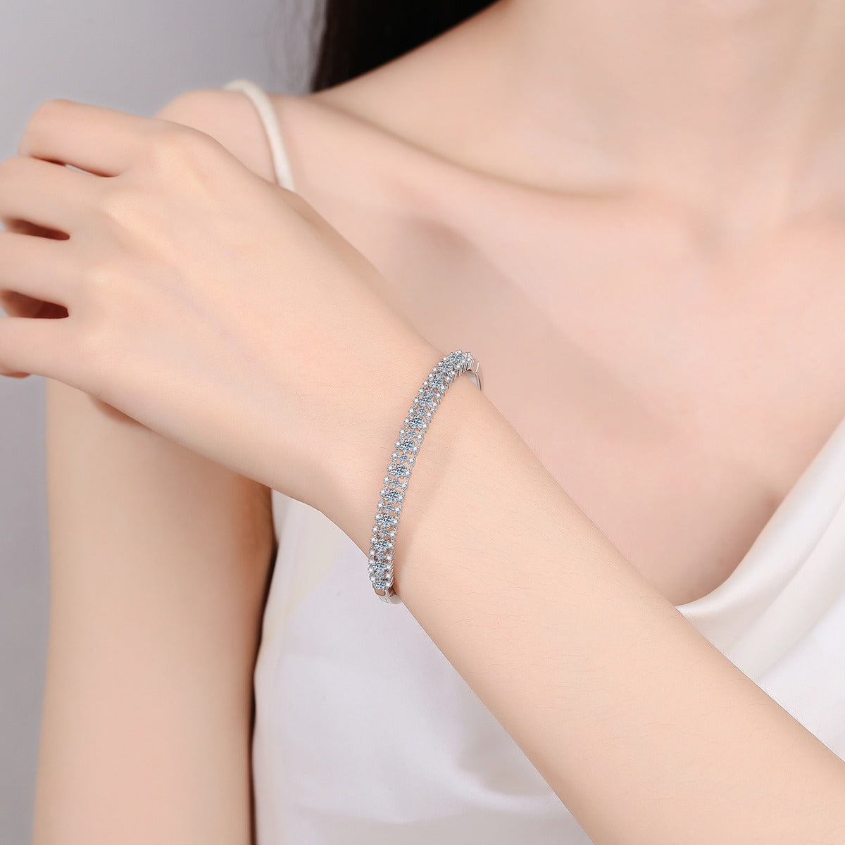 Multi-Size Round Moissanite Pave Bangle in Rhodium-Plated S925 sterling silver worn on wrist model view showing bangle scale and fit