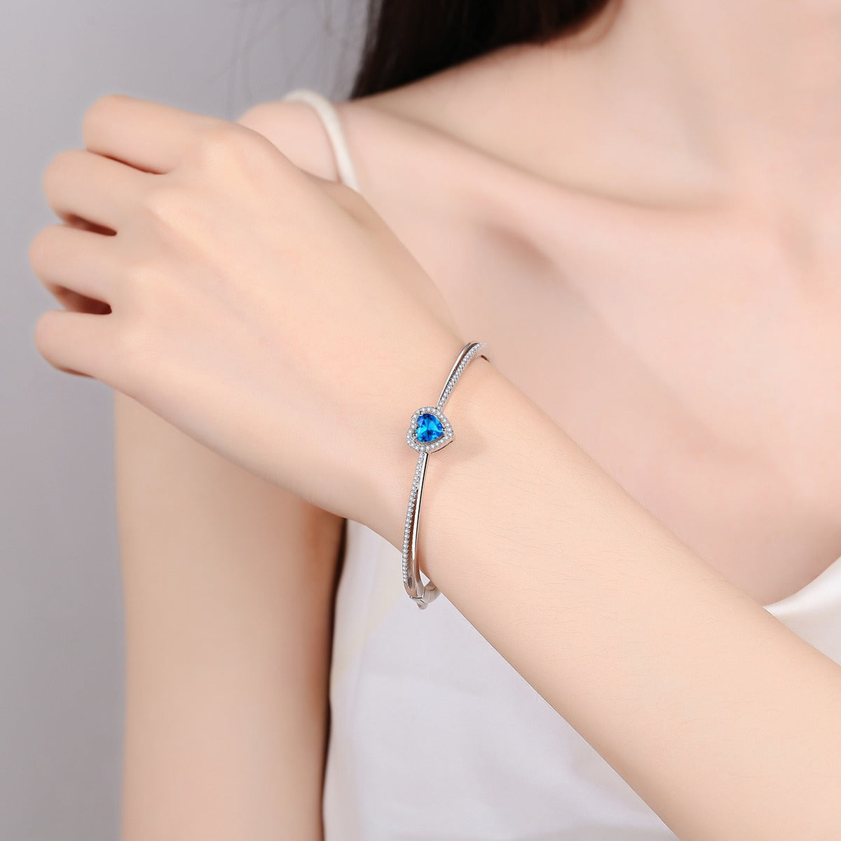 Heart-Cut Moissanite Bangle in Rhodium-Plated S925 sterling silver worn on wrist model view showing bangle scale and fit