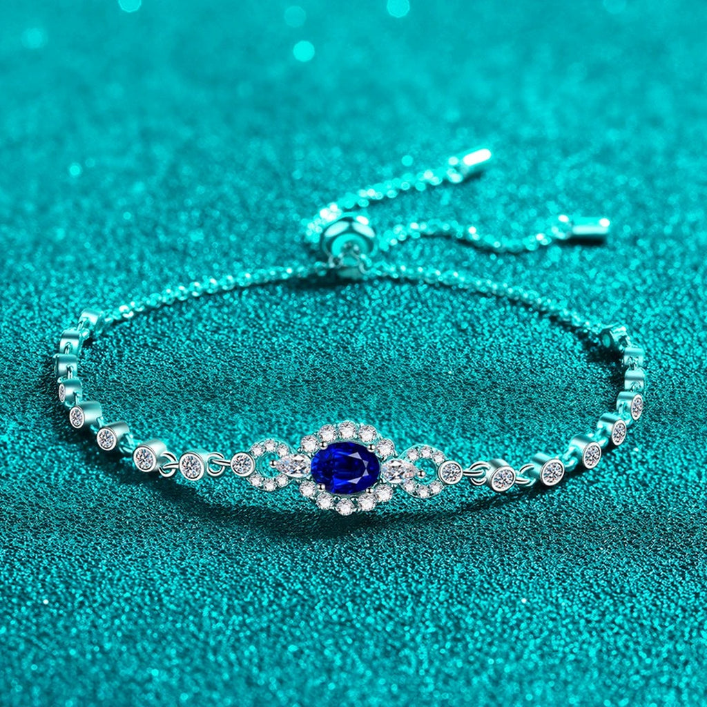 Oval Moissanite Tennis Bracelet with CZ in Rhodium-Plated S925 sterling silver angled product display showing bracelet silhouette