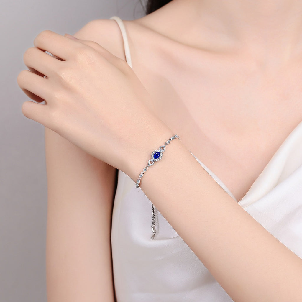 Oval Moissanite Tennis Bracelet with CZ in Rhodium-Plated S925 sterling silver worn on wrist model view showing scale and adjustable fit